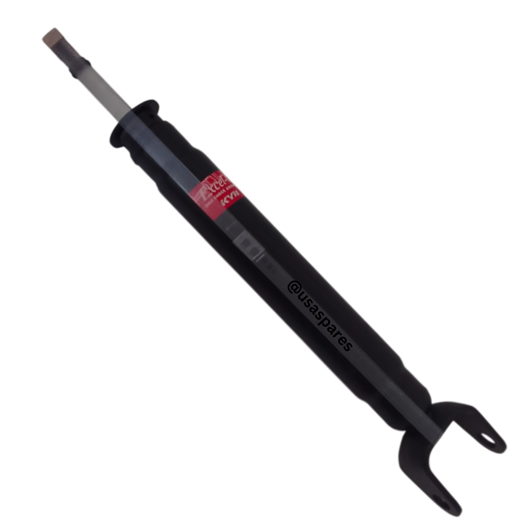 Brand new rear shocks for Jeep Grand Cherokee WK2, displayed on a clean surface, showing detailed view of mounting points and durable construction.