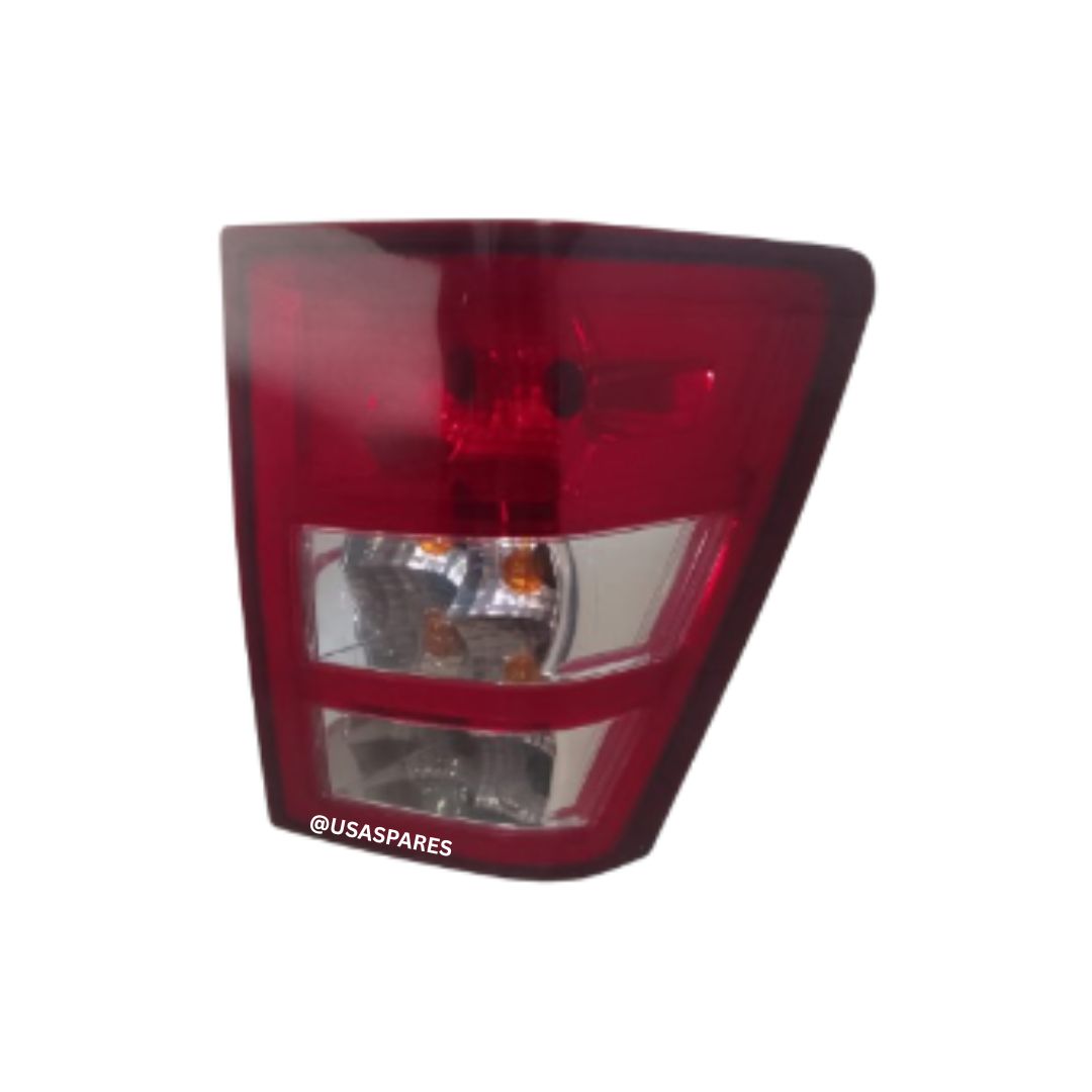 Jeep Grand Cherokee 3.0 WK1 used tail lights with clear lenses and OEM fit, displayed as a complete rear lighting replacement in good condition.