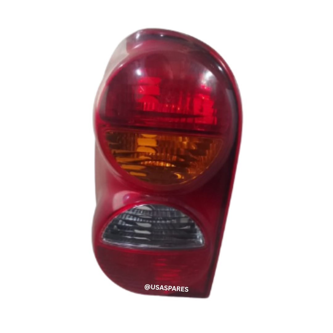 Jeep Cherokee 2.5 KJ used tail lights in good condition, showing rear view with intact lenses and OEM fitment for replacement.