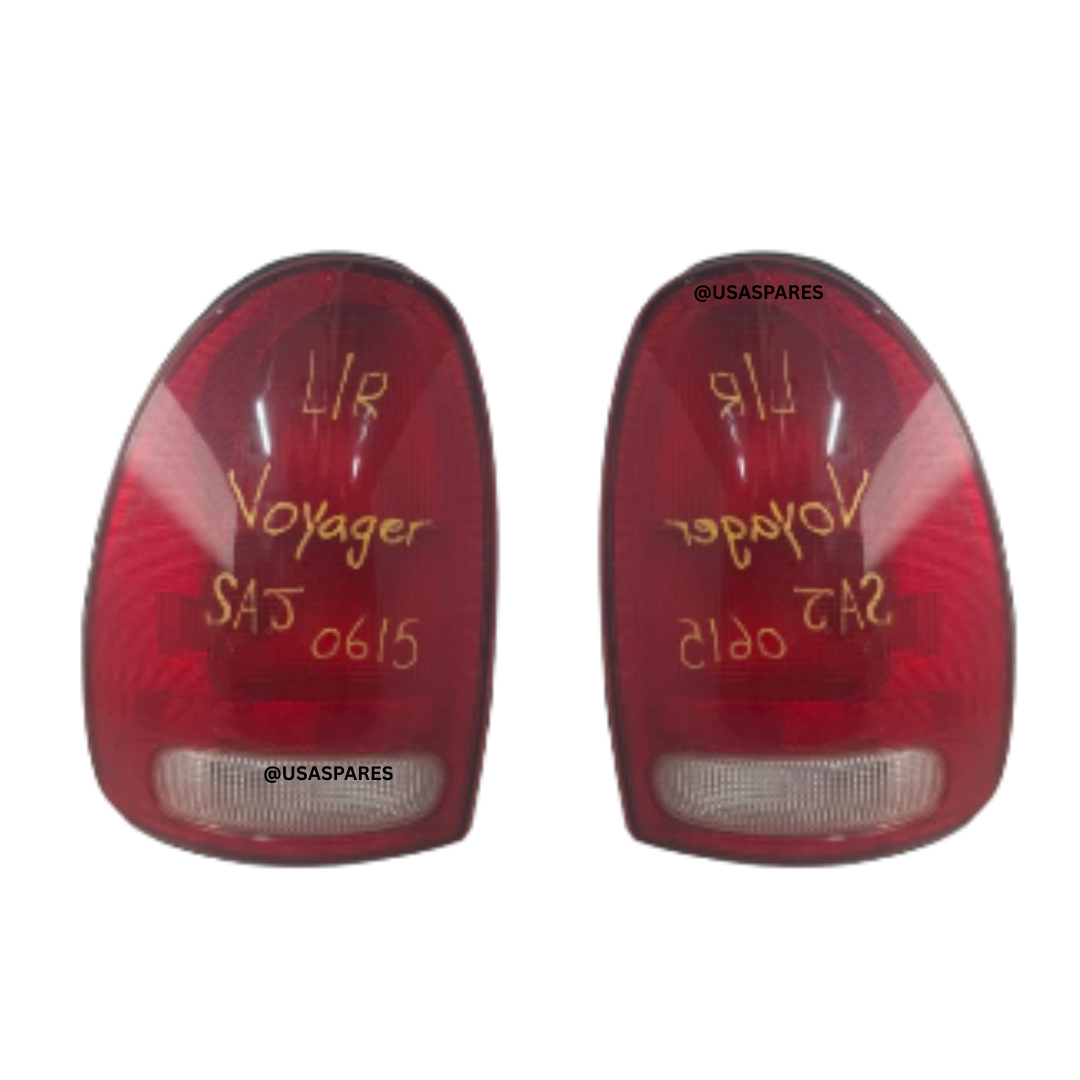Used Chrysler Voyager 3.3 tail lights with clear lenses and intact housing, ideal for rear light replacement and maintaining factory vehicle appearance.