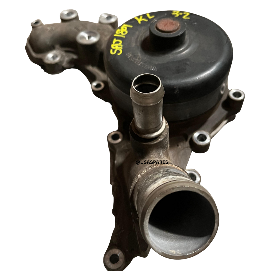 Used Jeep Cherokee 3.2 KL water pump, OEM replacement for restoring coolant circulation and preventing engine overheating.