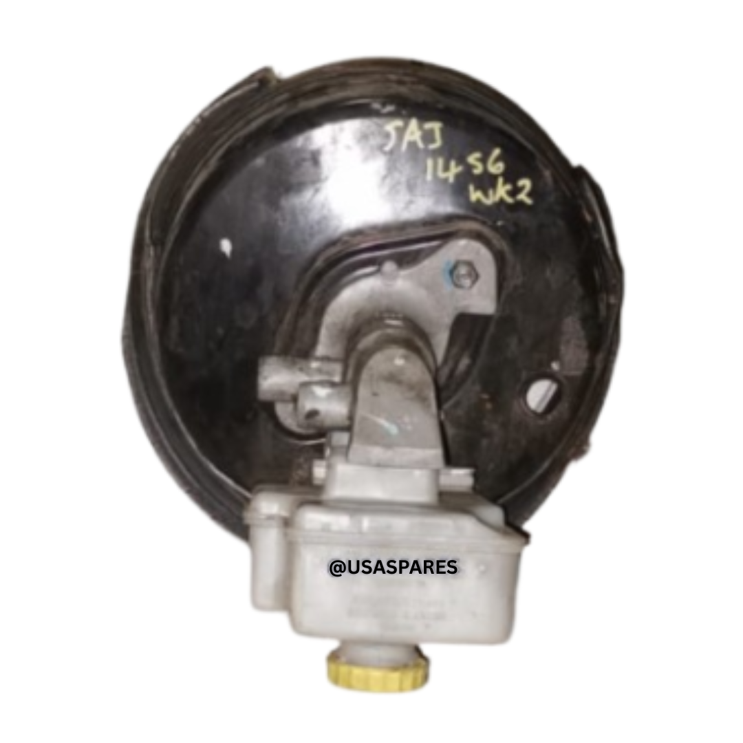 Used Jeep Grand Cherokee WK2 Brake Booster with mounting bracket and vacuum port, ready to restore proper brake pedal assistance.