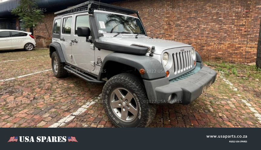 Image of 2010 Jeep Wrangler 3.8 JK Automatic Petrol stripping for spares, showing a dismantled vehicle with various used parts available including engine components, body panels, and interior parts.