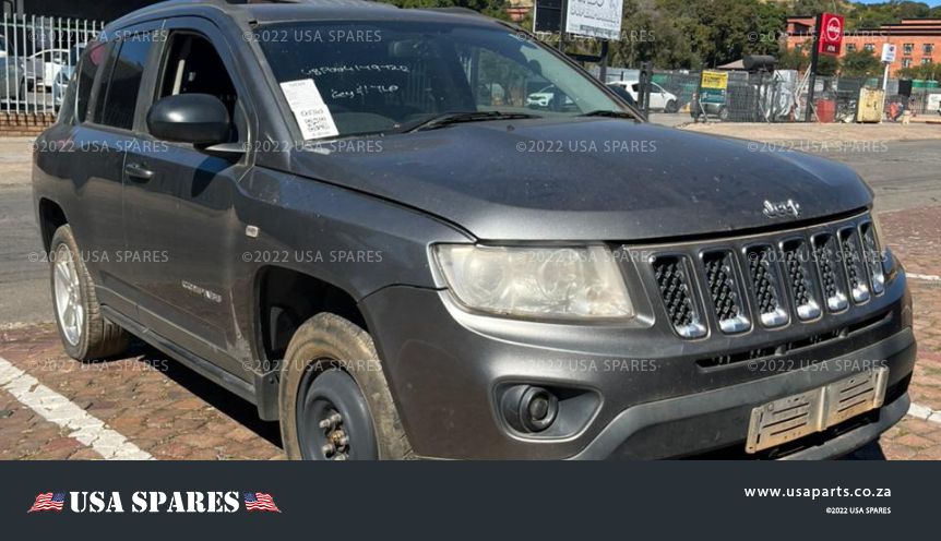 Image of 2012 Jeep Compass 2.0 Manual Petrol stripping for spares, showing dismantled vehicle components including engine parts, body panels, suspension, and interior items available for resale.