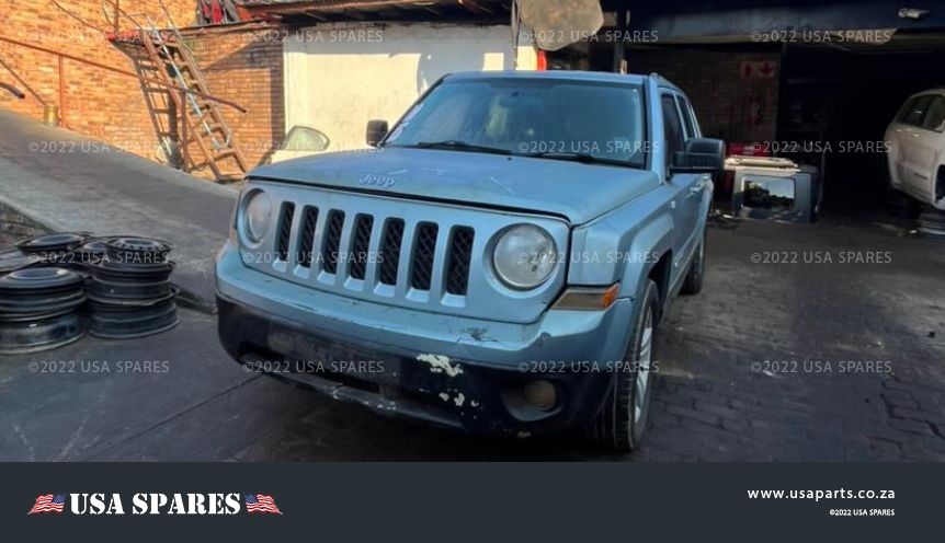 Image of 2014 Jeep Patriot 2.4 Manual Petrol stripping for spares, showing dismantled vehicle components including engine parts, suspension, body panels, and interior items available for resale.