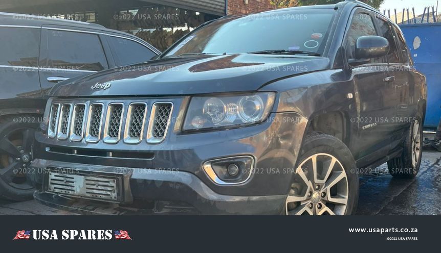 Image of 2014 Jeep Compass 2.0 Manual Petrol stripping for spares, showing dismantled vehicle components including engine parts, suspension, body panels, and interior items available for resale.